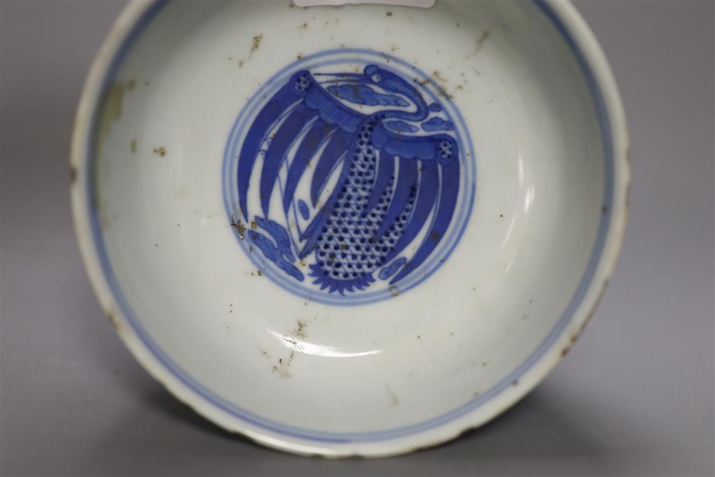 A late 19th century Chinese blue and white porcelain stem cup, decorated throughout with cranes, Qianlong mark to side, 8cm high, 11cm